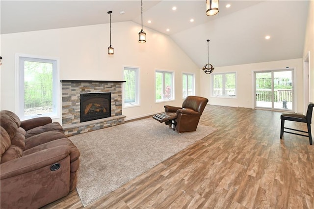 11 Brookview Blvd, Chestnut Ridge, NY 10977 - living room with high vaulted ceiling, wood finished floors, a stone fireplace, and recessed lighting