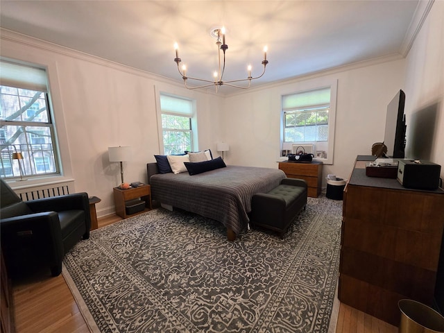 117-01 Park Ln S Unit A3C, Kew Gardens, NY 11415 - bedroom featuring wood finished floors, multiple windows, a chandelier, and crown molding