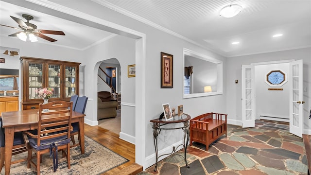 110 Driscoll Ave, Rockville Centre, NY 11570 - entrance foyer with baseboard heating, arched walkways, a ceiling fan, recessed lighting, and baseboards