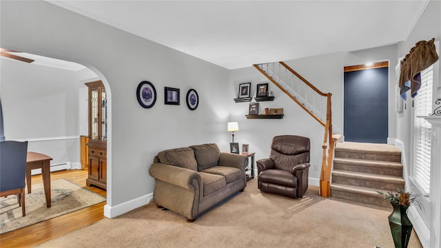 110 Driscoll Ave, Rockville Centre, NY 11570 - living area with stairway, baseboards, ceiling fan, and plenty of natural light