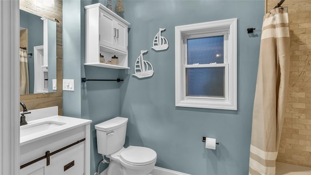 110 Driscoll Ave, Rockville Centre, NY 11570 - bathroom featuring toilet, vanity, and a shower with shower curtain