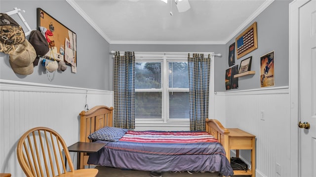 110 Driscoll Ave, Rockville Centre, NY 11570 - bedroom with crown molding, wainscoting, and ceiling fan