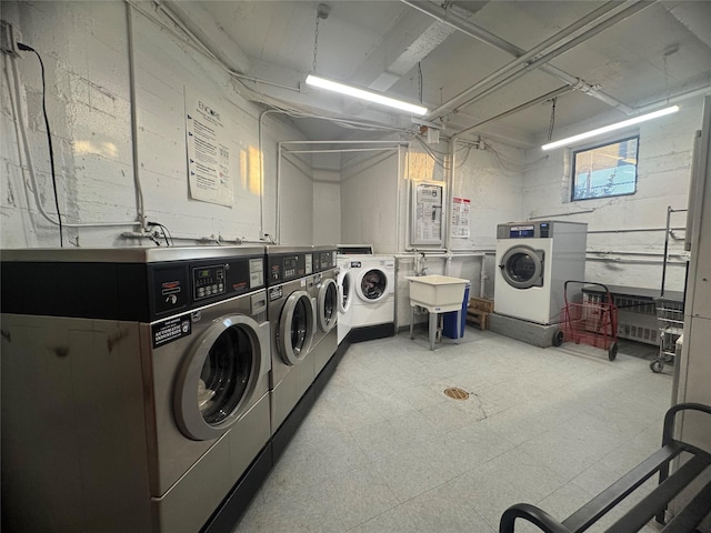 60-11 Broadway Unit L2, Woodside, NY 11377 - shared laundry room with separate washer and dryer and light flooring