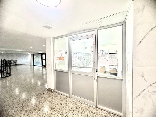 60-11 Broadway Unit L2, Woodside, NY 11377 - doorway to outside featuring speckled floor