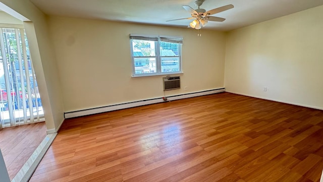 15307 79th Ave, Flushing, NY 11367 - empty room with baseboard heating, light wood-style floors, a ceiling fan, a wall mounted AC, and baseboards