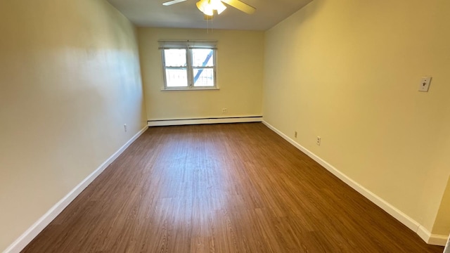 15307 79th Ave, Flushing, NY 11367 - spare room featuring a baseboard radiator, ceiling fan, dark wood-style floors, and baseboards