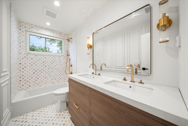 14 Kennedy Ln, West Islip, NY 11795 - full bathroom featuring double vanity, shower / bath combination, and toilet