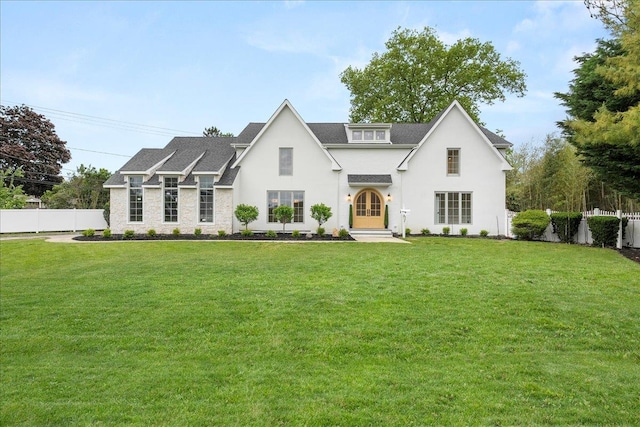 14 Kennedy Ln, West Islip, NY 11795 - view of front facade featuring stucco siding, a shingled roof, and french doors