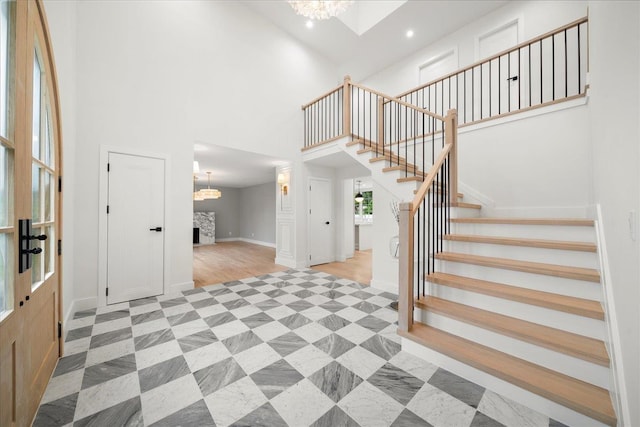 14 Kennedy Ln, West Islip, NY 11795 - foyer entrance featuring stairway, a high ceiling, a chandelier, recessed lighting, and baseboards
