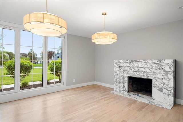 14 Kennedy Ln, West Islip, NY 11795 - unfurnished living room featuring wood finished floors, baseboards, and a fireplace