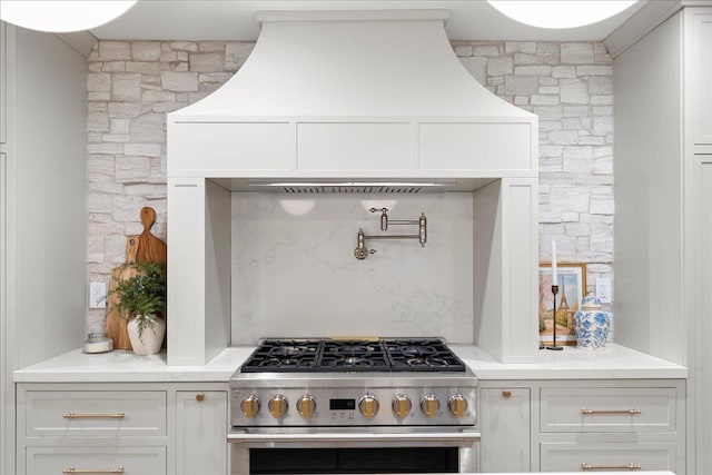 14 Kennedy Ln, West Islip, NY 11795 - kitchen featuring high end range, light countertops, and white cabinetry
