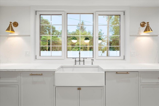 14 Kennedy Ln, West Islip, NY 11795 - kitchen featuring a sink, plenty of natural light, and light countertops
