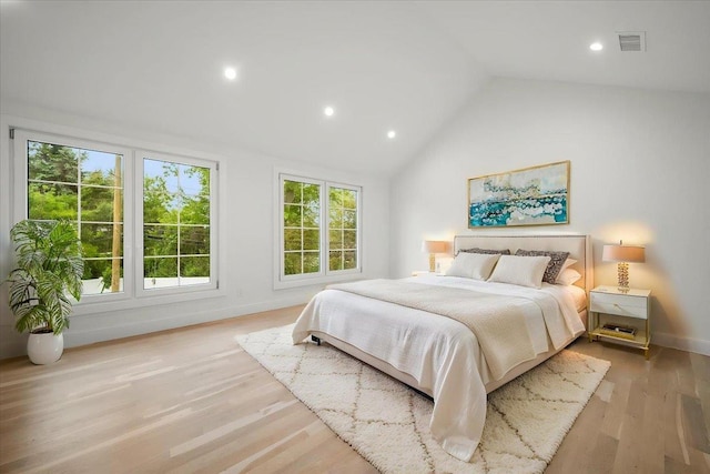 14 Kennedy Ln, West Islip, NY 11795 - bedroom with vaulted ceiling, wood finished floors, recessed lighting, and baseboards
