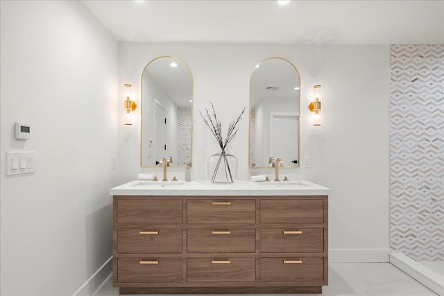 14 Kennedy Ln, West Islip, NY 11795 - bathroom featuring double vanity and baseboards