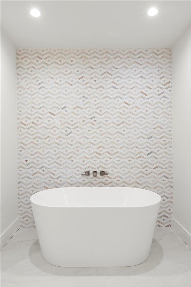 14 Kennedy Ln, West Islip, NY 11795 - bathroom with recessed lighting, a soaking tub, and baseboards