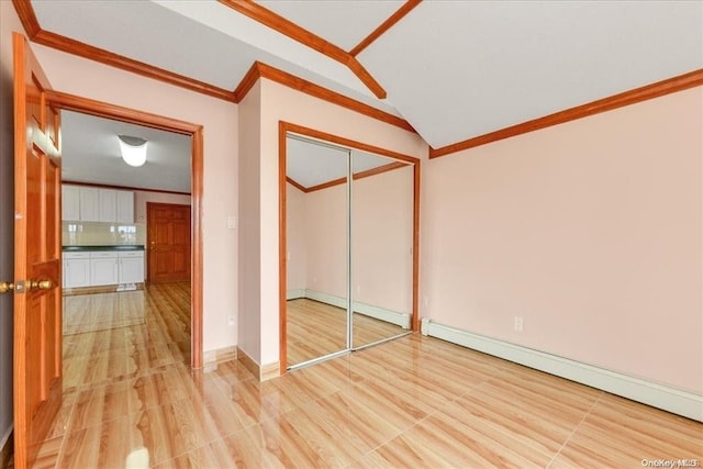 147-40 Jewel Ave, Kew Garden Hills, NY 11367 - unfurnished bedroom featuring a baseboard heating unit, ornamental molding, vaulted ceiling, a closet, and baseboard heating