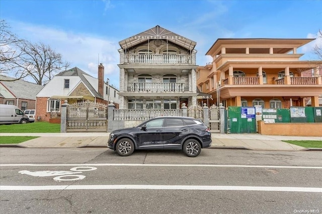 147-40 Jewel Ave, Kew Garden Hills, NY 11367 - view of front of home featuring a gate and stone siding