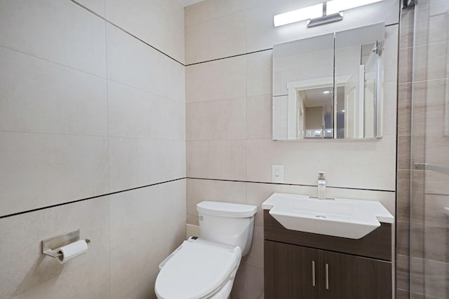 460 Old Town Rd Unit 25N, Port Jefferson Station, NY 11776 - bathroom with toilet, tile walls, and vanity