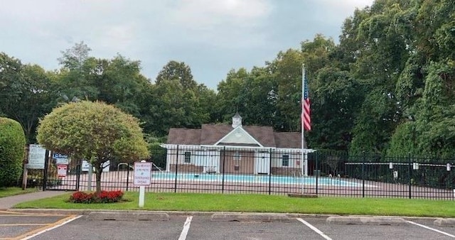 460 Old Town Rd Unit 25N, Port Jefferson Station, NY 11776 - surrounding community featuring uncovered parking and a swimming pool