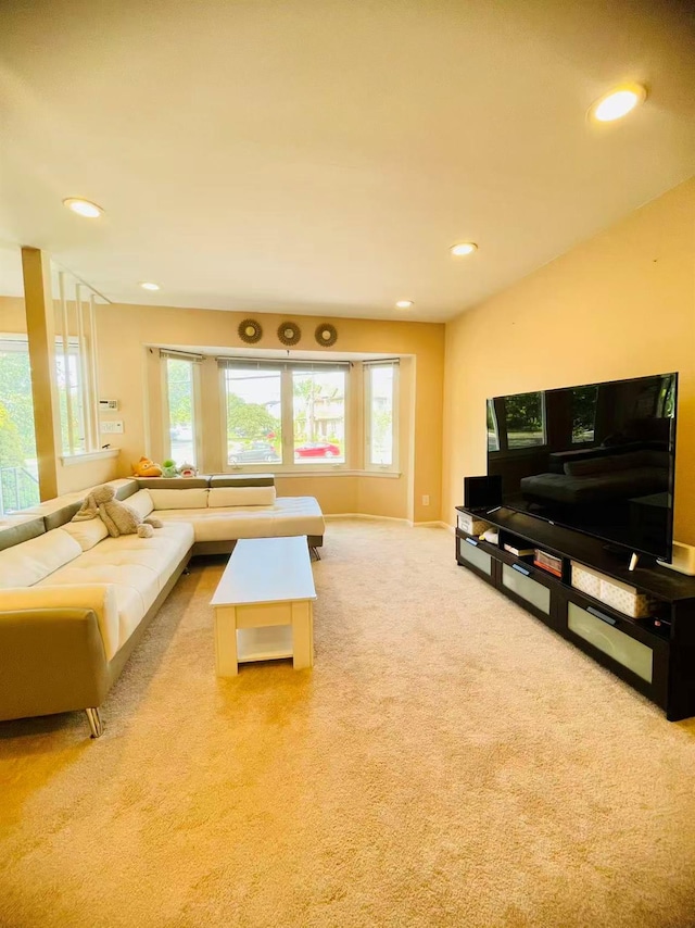 663 Woodbury Rd, Oyster Bay, NY 11791 - living room with light colored carpet, recessed lighting, and baseboards