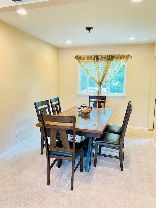 663 Woodbury Rd, Oyster Bay, NY 11791 - dining room featuring light colored carpet, baseboards, and recessed lighting
