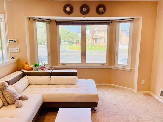 663 Woodbury Rd, Oyster Bay, NY 11791 - living area with carpet and baseboards