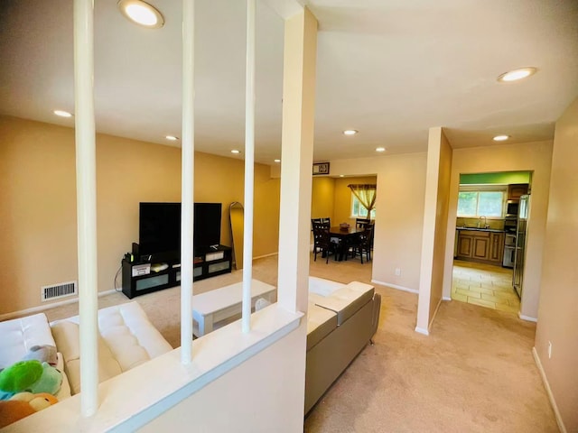 663 Woodbury Rd, Oyster Bay, NY 11791 - living area with light colored carpet, recessed lighting, and baseboards