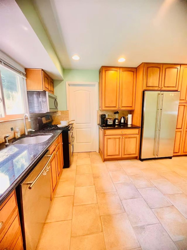 663 Woodbury Rd, Oyster Bay, NY 11791 - kitchen with appliances with stainless steel finishes, a sink, decorative backsplash, recessed lighting, and brown cabinets