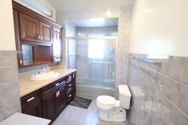 22-23 147th St, Whitestone, NY 11357 - full bath featuring tile walls, toilet, vanity, and shower / bath combination with glass door