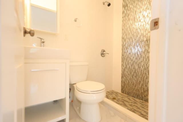 22-23 147th St, Whitestone, NY 11357 - bathroom with toilet, tiled shower, and vanity