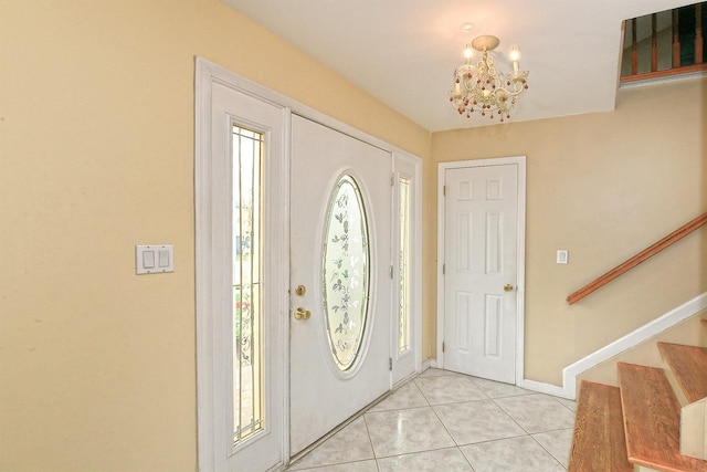 6 Country Ct, Farmingdale, NY 11735 - foyer entrance featuring a chandelier, light tile patterned floors, stairs, and baseboards