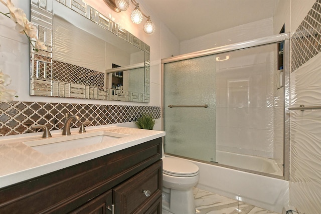 6 Country Ct, Farmingdale, NY 11735 - full bath with toilet, combined bath / shower with glass door, marble look tiles, tasteful backsplash, and vanity