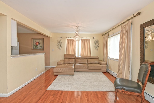 6 Country Ct, Farmingdale, NY 11735 - living area featuring a chandelier, a baseboard radiator, and wood finished floors
