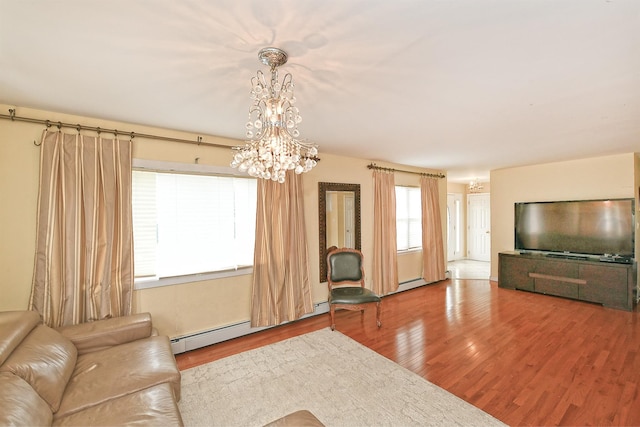 6 Country Ct, Farmingdale, NY 11735 - unfurnished living room featuring a chandelier, wood finished floors, and a baseboard radiator