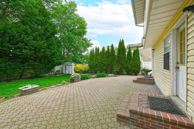 6 Country Ct, Farmingdale, NY 11735 - view of patio featuring an outdoor fire pit