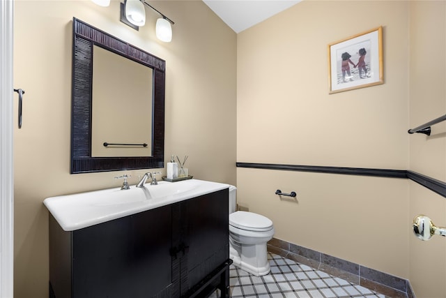 47 Valley Rd, Old Westbury, NY 11568 - half bathroom with toilet, vanity, tile patterned flooring, and baseboards