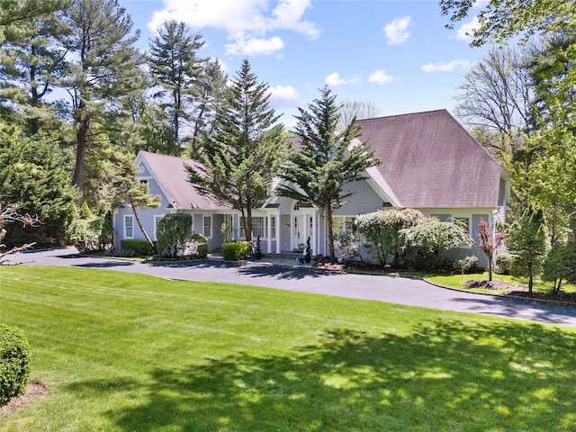 47 Valley Rd, Old Westbury, NY 11568 - view of front of house featuring a front lawn