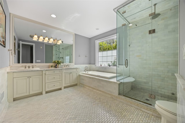 47 Valley Rd, Old Westbury, NY 11568 - full bathroom featuring a bath, a shower stall, toilet, double vanity, and recessed lighting