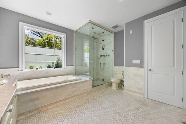 47 Valley Rd, Old Westbury, NY 11568 - bathroom featuring tile walls, a stall shower, vanity, a bath, and a wainscoted wall