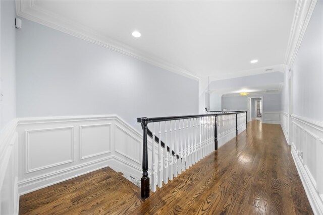 47 Valley Rd, Old Westbury, NY 11568 - hallway with a decorative wall, an upstairs landing, crown molding, a wainscoted wall, and wood finished floors