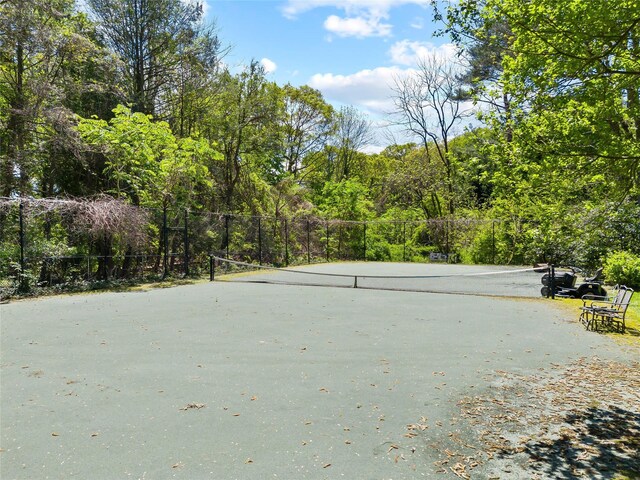 47 Valley Rd, Old Westbury, NY 11568 - view of home's community featuring a tennis court and a view of trees