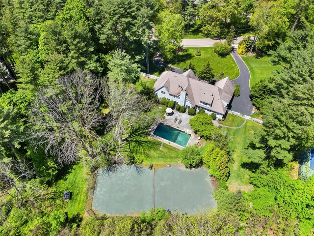 47 Valley Rd, Old Westbury, NY 11568 - view of subject property featuring a pool area and a nearby body of water