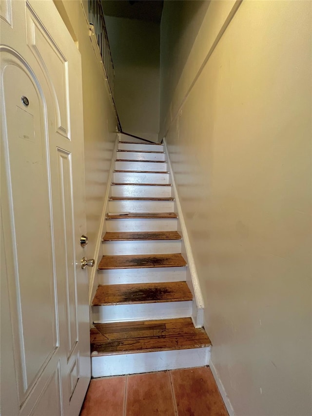 620 E 182nd St, Bronx, NY 10457 - stairs featuring tile patterned floors and baseboards