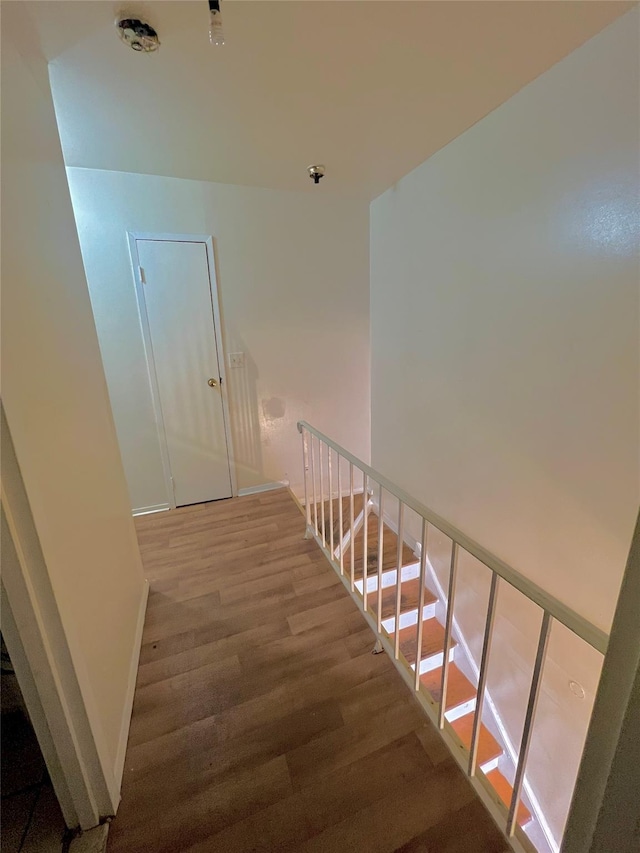 620 E 182nd St, Bronx, NY 10457 - stairway featuring wood finished floors and baseboards