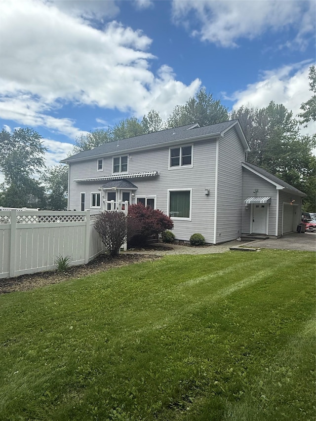 12 Rosell Ct, Lagrangeville, NY 12540 - rear view of property featuring an attached garage and asphalt driveway