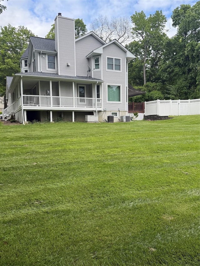12 Rosell Ct, Lagrangeville, NY 12540 - back of property featuring a chimney, central AC, and roof with shingles