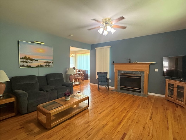 12 Rosell Ct, Lagrangeville, NY 12540 - living area with ceiling fan, wood finished floors, a high end fireplace, and baseboards