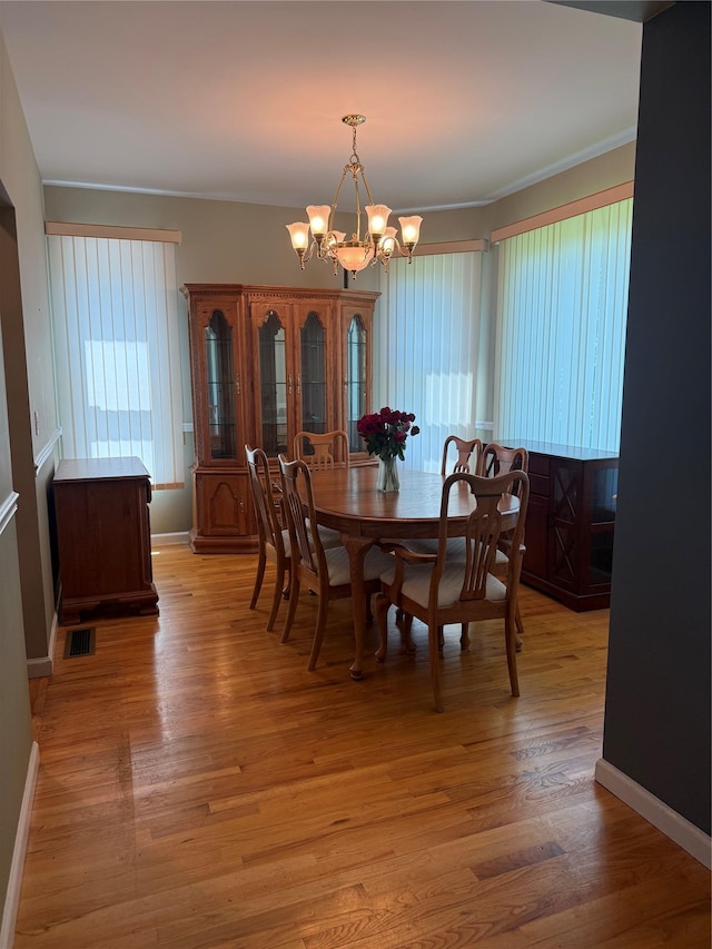 12 Rosell Ct, Lagrangeville, NY 12540 - dining room featuring a chandelier, crown molding, light wood-style flooring, and baseboards