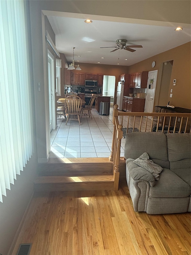 12 Rosell Ct, Lagrangeville, NY 12540 - living room with ceiling fan, light wood finished floors, recessed lighting, and baseboards