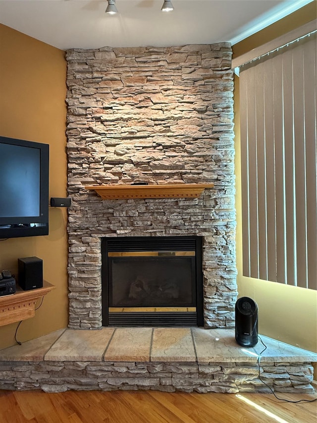 12 Rosell Ct, Lagrangeville, NY 12540 - detailed view of wood finished floors and a stone fireplace